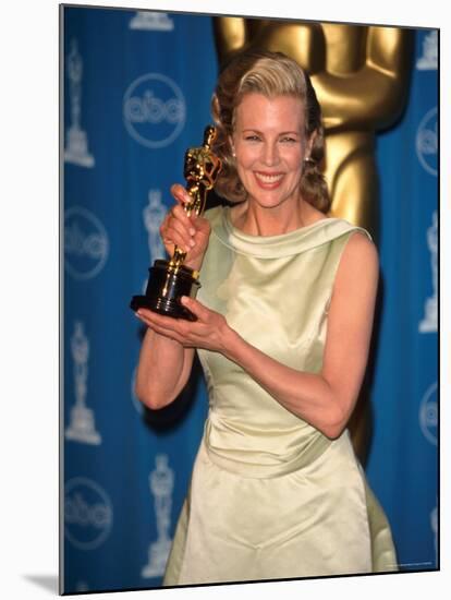 Kim Basinger Holding Her Oscar in Press Room at Academy Awards-Mirek Towski-Mounted Premium Photographic Print