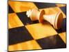 King chess piece lying on chessboard-null-Mounted Photographic Print