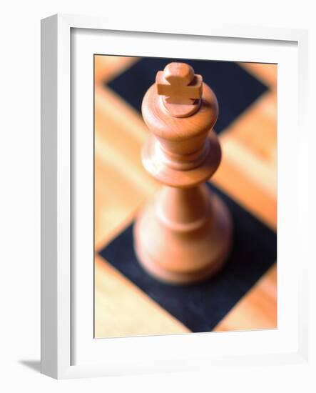 King chess piece on chessboard-null-Framed Photographic Print