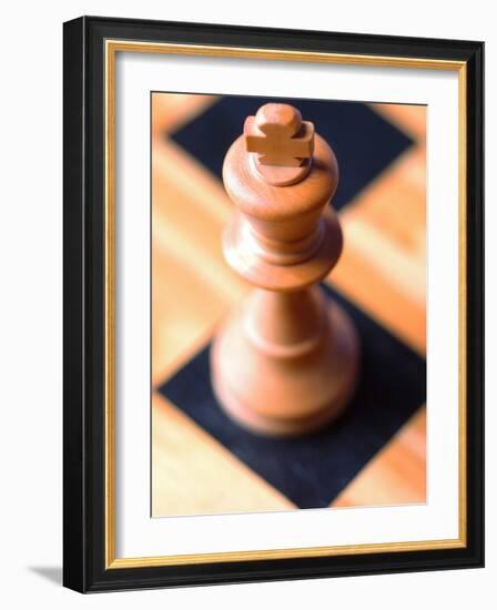 King chess piece on chessboard-null-Framed Photographic Print