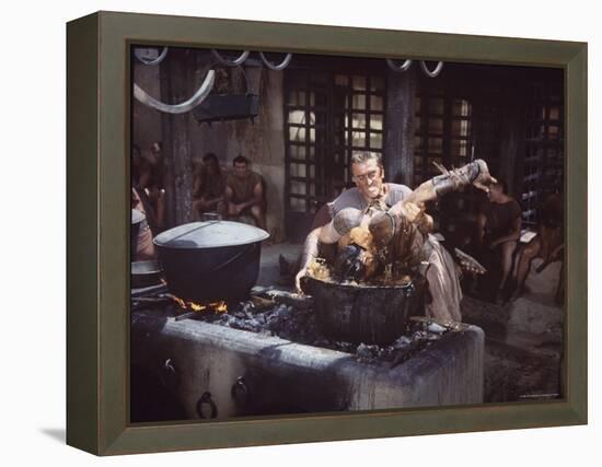 Kirk Douglas Dunking Enemy's Head in Giant Cook Pot in Scene From Stanley Kubrick's "Spartacus"-J^ R^ Eyerman-Framed Premier Image Canvas