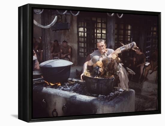 Kirk Douglas Dunking Enemy's Head in Giant Cook Pot in Scene From Stanley Kubrick's "Spartacus"-J^ R^ Eyerman-Framed Premier Image Canvas