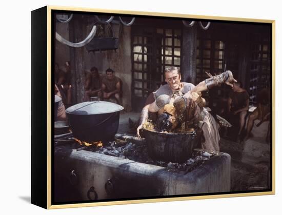 Kirk Douglas Dunking Enemy's Head in Giant Cook Pot in Scene From Stanley Kubrick's "Spartacus"-J^ R^ Eyerman-Framed Premier Image Canvas