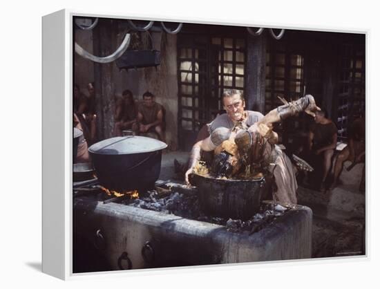 Kirk Douglas Dunking Enemy's Head in Giant Cook Pot in Scene From Stanley Kubrick's "Spartacus"-J^ R^ Eyerman-Framed Premier Image Canvas