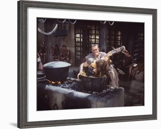 Kirk Douglas Dunking Enemy's Head in Giant Cook Pot in Scene From Stanley Kubrick's "Spartacus"-J^ R^ Eyerman-Framed Premium Photographic Print