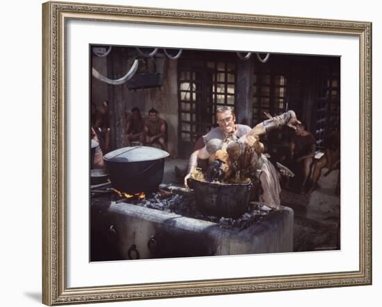 Kirk Douglas Dunking Enemy's Head in Giant Cook Pot in Scene From Stanley Kubrick's "Spartacus"-J^ R^ Eyerman-Framed Premium Photographic Print