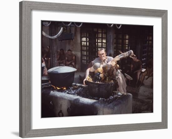 Kirk Douglas Dunking Enemy's Head in Giant Cook Pot in Scene From Stanley Kubrick's "Spartacus"-J^ R^ Eyerman-Framed Premium Photographic Print