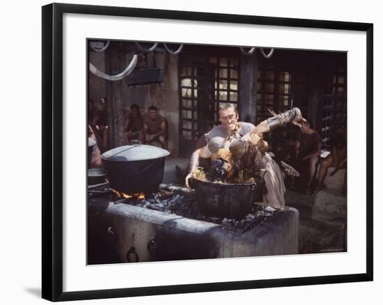 Kirk Douglas Dunking Enemy's Head in Giant Cook Pot in Scene From Stanley Kubrick's "Spartacus"-J^ R^ Eyerman-Framed Premium Photographic Print