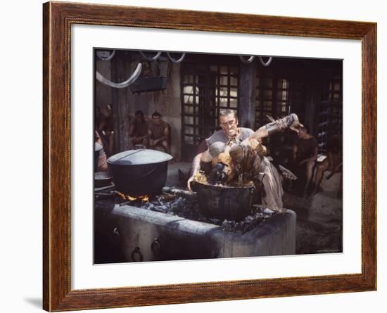 Kirk Douglas Dunking Enemy's Head in Giant Cook Pot in Scene From Stanley Kubrick's "Spartacus"-J^ R^ Eyerman-Framed Premium Photographic Print