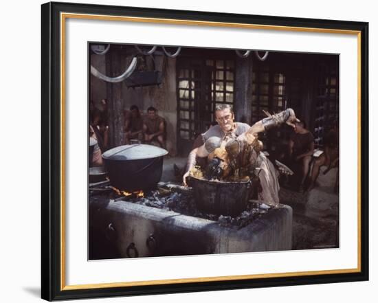 Kirk Douglas Dunking Enemy's Head in Giant Cook Pot in Scene From Stanley Kubrick's "Spartacus"-J^ R^ Eyerman-Framed Premium Photographic Print