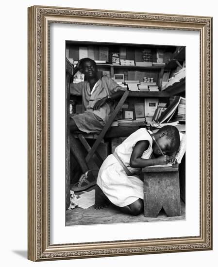 Kneeling Schoolgirl Writing on Wooden Bench. Accura, Gold Coast, Ghana-Alfred Eisenstaedt-Framed Photographic Print