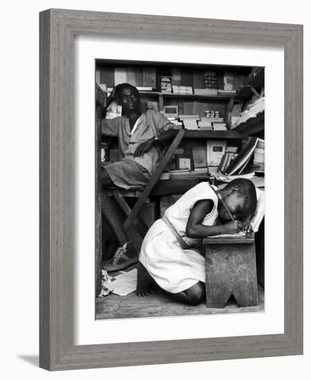 Kneeling Schoolgirl Writing on Wooden Bench. Accura, Gold Coast, Ghana-Alfred Eisenstaedt-Framed Photographic Print