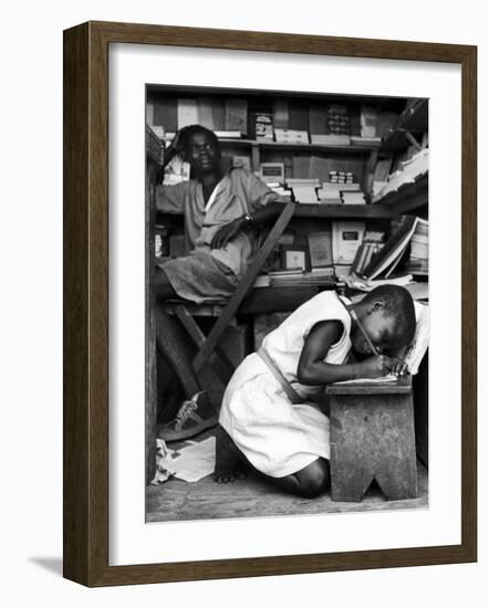 Kneeling Schoolgirl Writing on Wooden Bench. Accura, Gold Coast, Ghana-Alfred Eisenstaedt-Framed Photographic Print