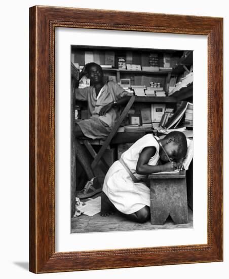 Kneeling Schoolgirl Writing on Wooden Bench. Accura, Gold Coast, Ghana-Alfred Eisenstaedt-Framed Photographic Print