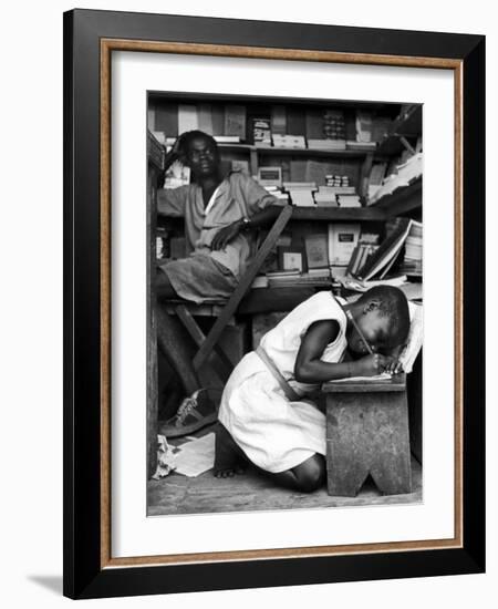 Kneeling Schoolgirl Writing on Wooden Bench. Accura, Gold Coast, Ghana-Alfred Eisenstaedt-Framed Photographic Print