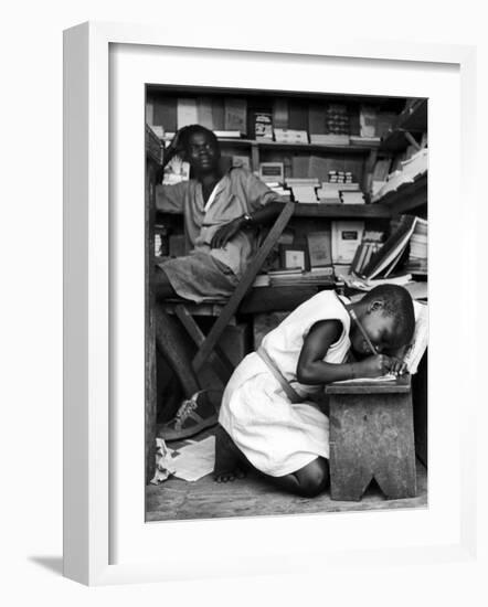 Kneeling Schoolgirl Writing on Wooden Bench. Accura, Gold Coast, Ghana-Alfred Eisenstaedt-Framed Photographic Print