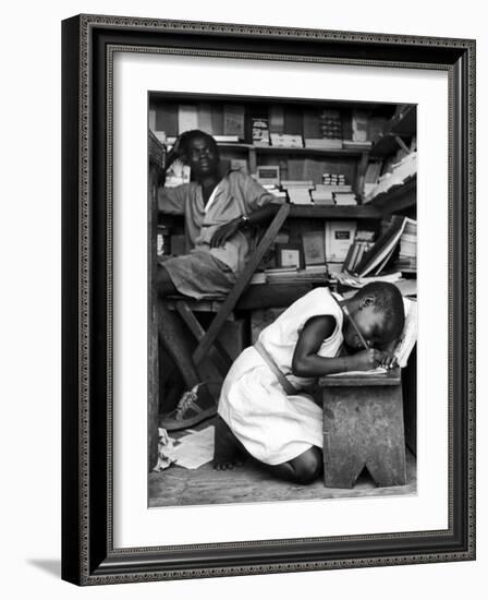 Kneeling Schoolgirl Writing on Wooden Bench. Accura, Gold Coast, Ghana-Alfred Eisenstaedt-Framed Photographic Print