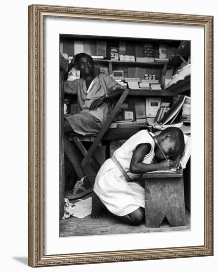 Kneeling Schoolgirl Writing on Wooden Bench. Accura, Gold Coast, Ghana-Alfred Eisenstaedt-Framed Photographic Print