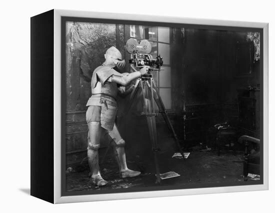 Knight at the Movies, a Man in an Armored Suit Uses a Film Camera-null-Framed Stretched Canvas