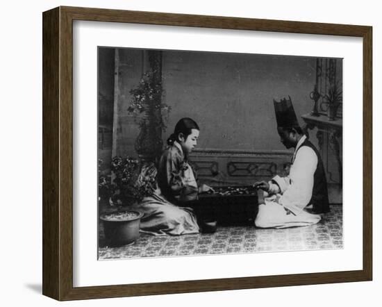 Korean Man and Woman Playing a Game Photograph - Korea-Lantern Press-Framed Art Print