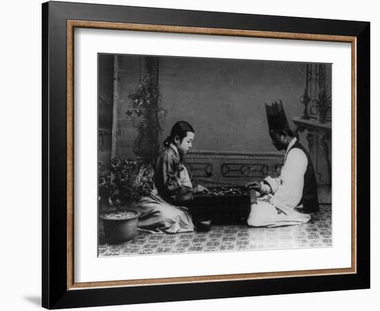 Korean Man and Woman Playing a Game Photograph - Korea-Lantern Press-Framed Art Print