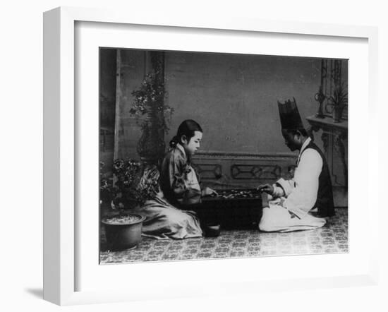 Korean Man and Woman Playing a Game Photograph - Korea-Lantern Press-Framed Art Print