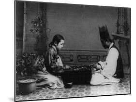 Korean Man and Woman Playing a Game Photograph - Korea-Lantern Press-Mounted Art Print