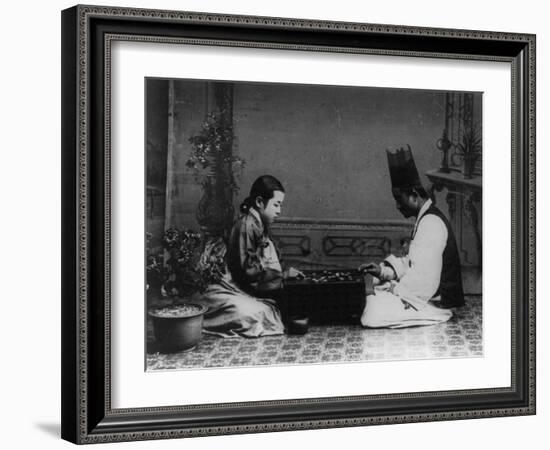 Korean Man and Woman Playing a Game Photograph - Korea-Lantern Press-Framed Art Print