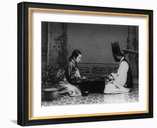 Korean Man and Woman Playing a Game Photograph - Korea-Lantern Press-Framed Art Print