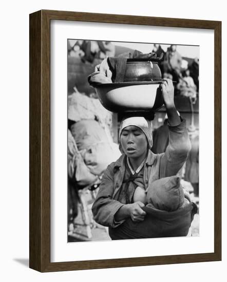 Korean Mother Nursing Her Baby, Carrying All Her Belongings in a Wash Basin, Retreating from Seoul-Carl Mydans-Framed Photographic Print