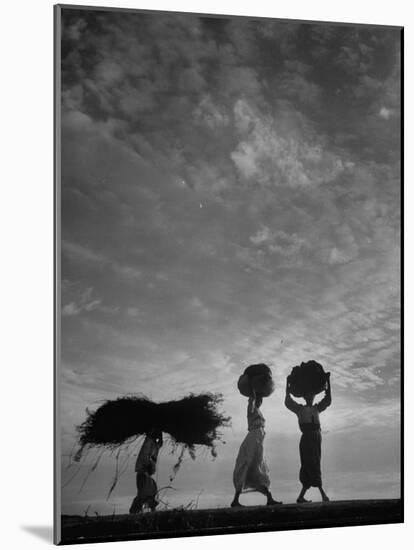 Korean Peasants Carrying Bundles on Their Heads-Michael Rougier-Mounted Photographic Print