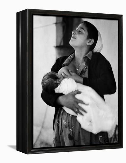 Kurdi Mother, One of the Most Primitive Tribes of Israel, Nursing Child in Mountain Colony-Paul Schutzer-Framed Premier Image Canvas