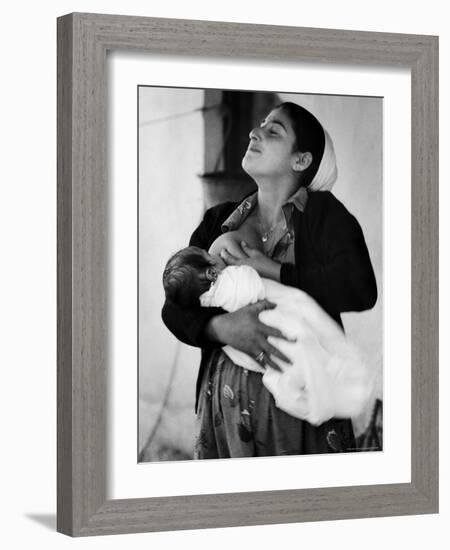 Kurdi Mother, One of the Most Primitive Tribes of Israel, Nursing Child in Mountain Colony-Paul Schutzer-Framed Photographic Print