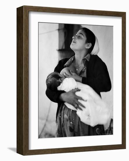 Kurdi Mother, One of the Most Primitive Tribes of Israel, Nursing Child in Mountain Colony-Paul Schutzer-Framed Photographic Print