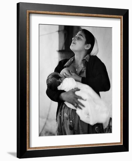 Kurdi Mother, One of the Most Primitive Tribes of Israel, Nursing Child in Mountain Colony-Paul Schutzer-Framed Photographic Print