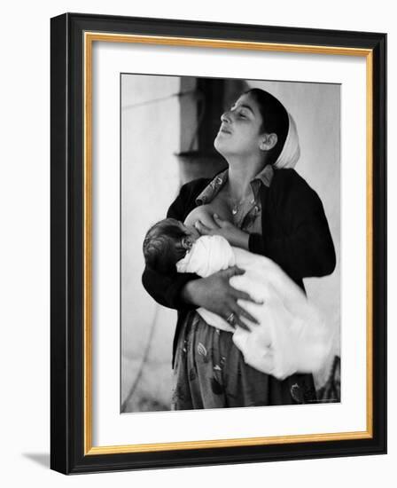 Kurdi Mother, One of the Most Primitive Tribes of Israel, Nursing Child in Mountain Colony-Paul Schutzer-Framed Photographic Print