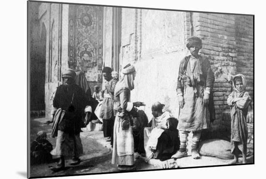 Kurdish Barber, Outside Kazimain Mosque, Iraq, 1917-1919-null-Mounted Giclee Print