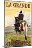 La Grande, Oregon - Cowboy on Bluff-Lantern Press-Mounted Art Print