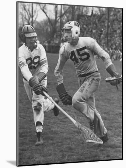 Lacrosse Game Between Johns Hopkins and Virginia-null-Mounted Photographic Print