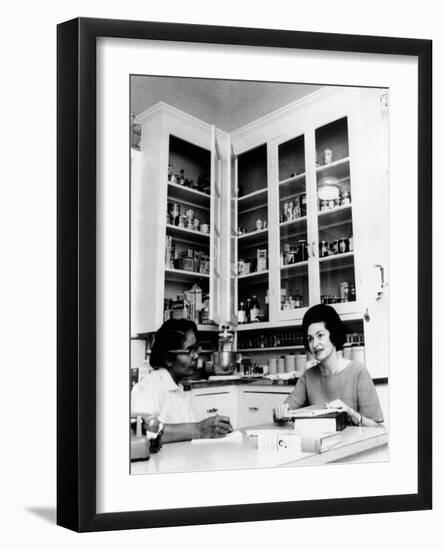 Lady Bird Johnson, in the Kitchen with Her African American Cook, Zephyr Wright-null-Framed Photo