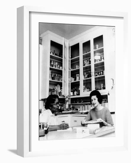 Lady Bird Johnson, in the Kitchen with Her African American Cook, Zephyr Wright-null-Framed Photo