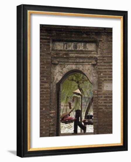 Lady Carrying Baskets, Hoan Kiem Lake, Hanoi, Northern Vietnam, Southeast Asia-Christian Kober-Framed Photographic Print