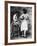 Lady Tries on a Corset While Another Woman Waits with Another One-null-Framed Photographic Print