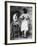 Lady Tries on a Corset While Another Woman Waits with Another One-null-Framed Photographic Print