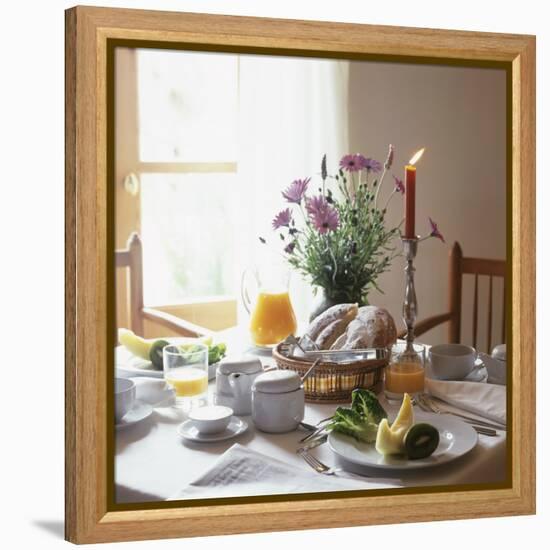 Laid Breakfast Table with Baked Goods, Juice and Fruit-null-Framed Premier Image Canvas