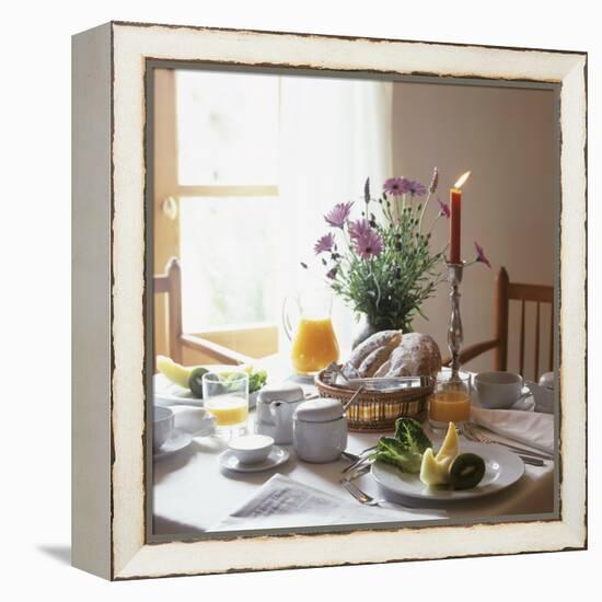 Laid Breakfast Table with Baked Goods, Juice and Fruit-null-Framed Premier Image Canvas