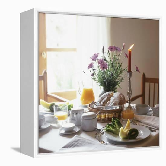 Laid Breakfast Table with Baked Goods, Juice and Fruit-null-Framed Premier Image Canvas