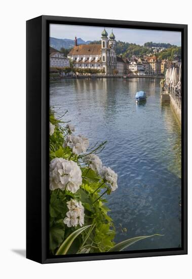 Lake Lucerne, Switzerland. Famous walking bridge and swans in river during the fall season.-Michele Niles-Framed Premier Image Canvas