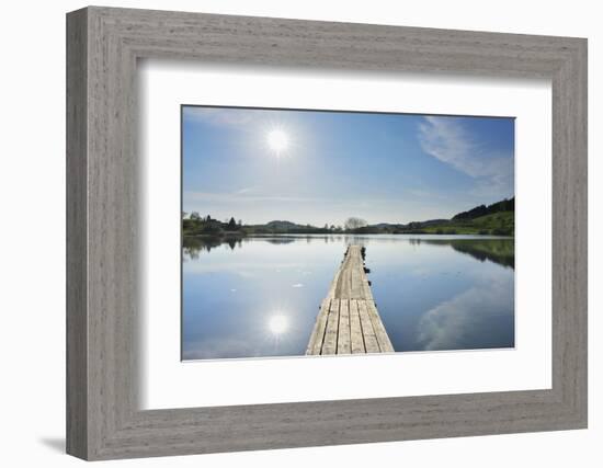 Lake with wooden jetty and sun, Muttelsee, Tettnang Baden-Wurttemberg, Germany-Raimund Linke-Framed Photographic Print