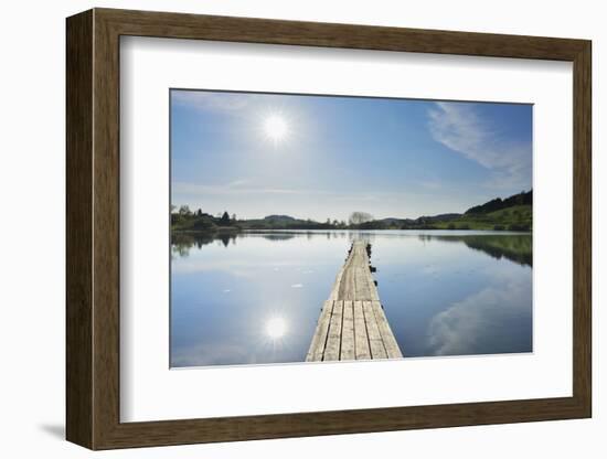 Lake with wooden jetty and sun, Muttelsee, Tettnang Baden-Wurttemberg, Germany-Raimund Linke-Framed Photographic Print